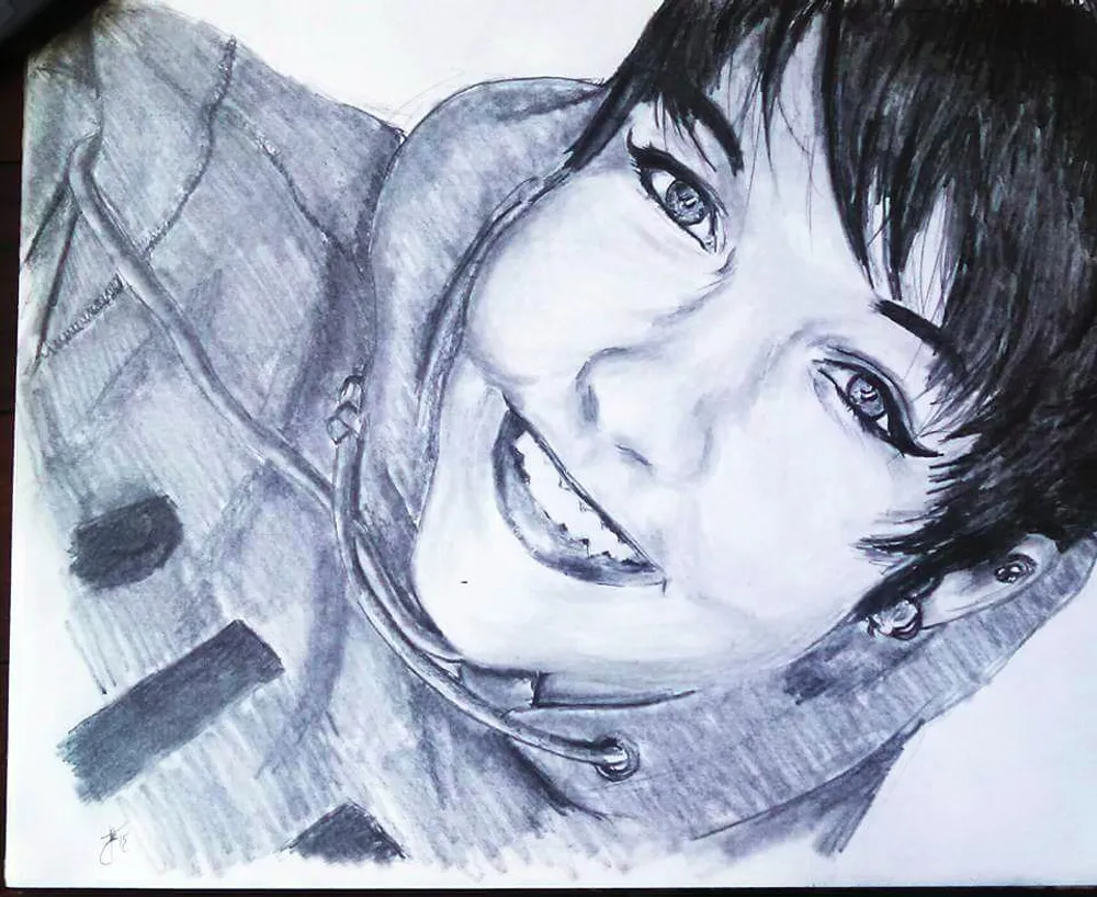 a young person smiling widely, wearing a hooded jacket