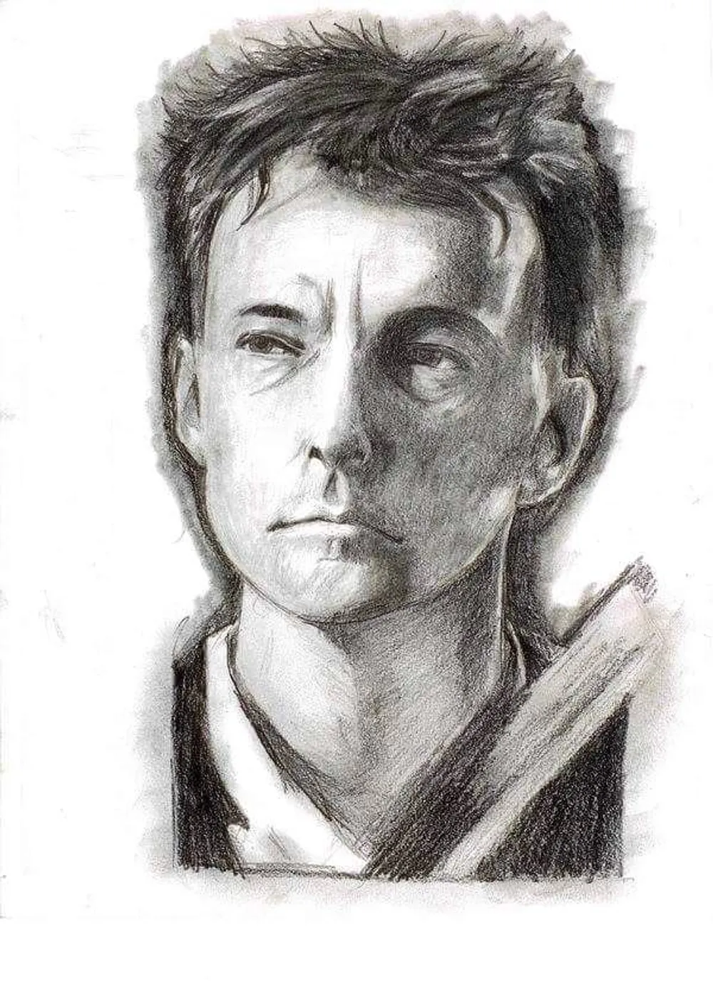 a young man with short hair, neutral expression