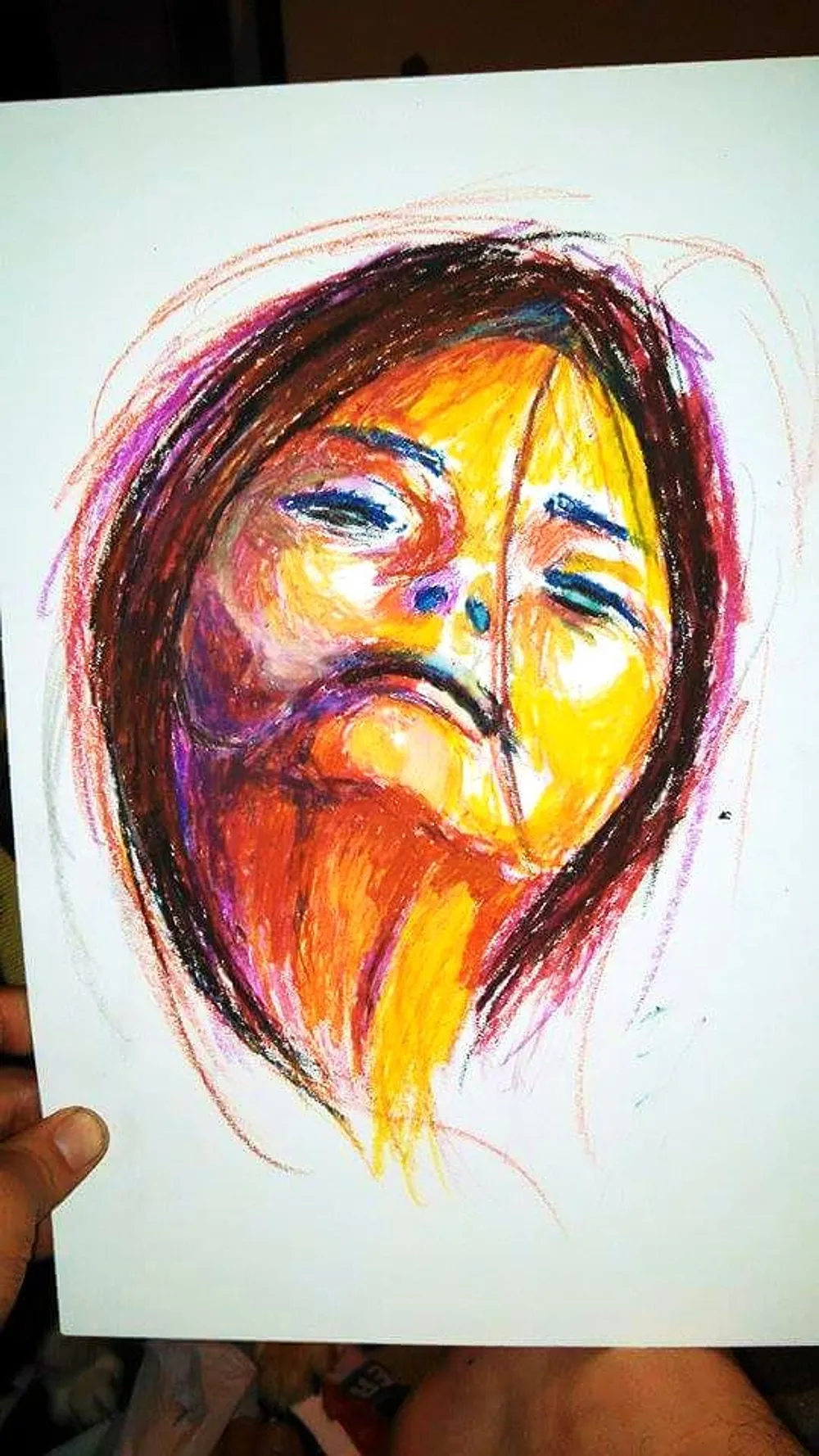an abstracted face in orange, yellow, and purple